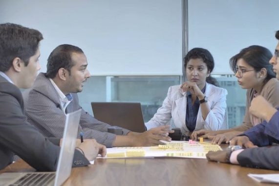 An Indian mixed gender team members brainstorming…