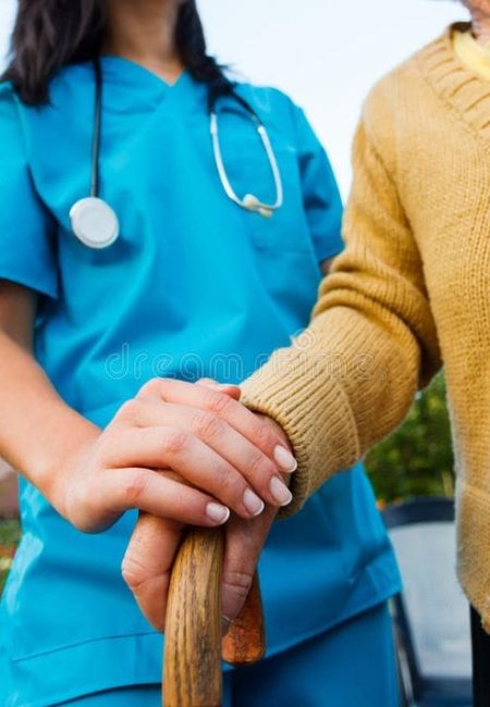 Caring for the Needy_ Doctor holding a senior…