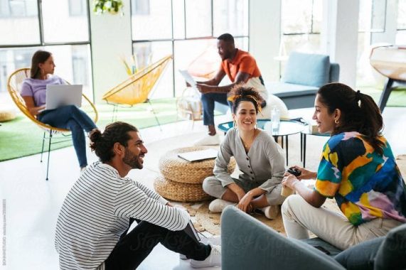 Friendly Diverse Colleagues Talking In Creative…